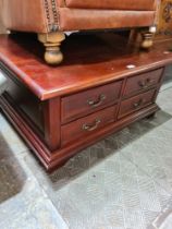 A reproduction mahogany coffee table, having 8 drawers
