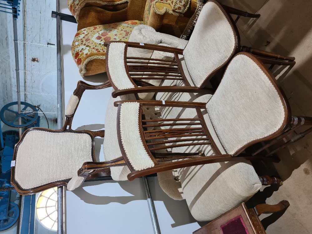 A pair of Edwardian Besel chairs, a modern chaise longue and an open armchair