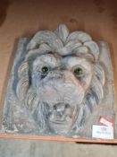 A lead style lion mask wall plaque
