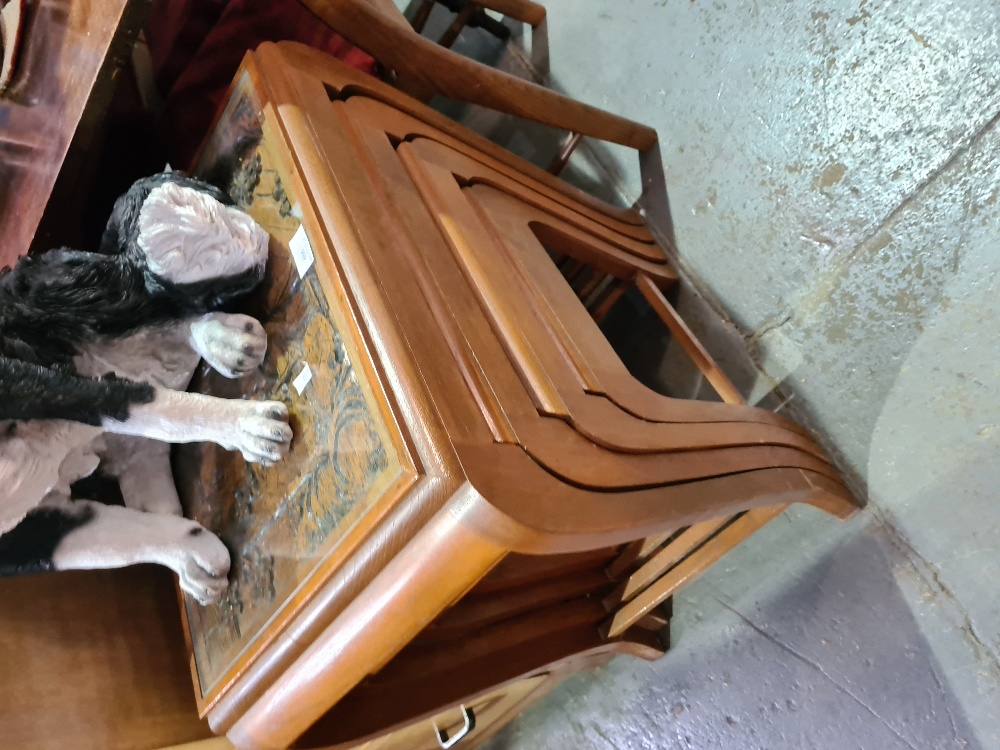 A nest of four oriental carved coffee tables