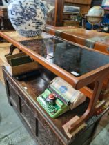 A G-Plan style 1970s coffee table having tile and smokey glass top, 121cm