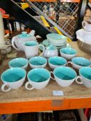 A small quantity of vintage Poole teaware having turquoise interiors