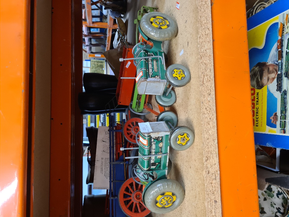 Two vintage tinplate clockwork tractors and other farm accessories (possibly Tri-ang) and a non rela