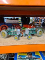 Two vintage tinplate clockwork tractors and other farm accessories (possibly Tri-ang) and a non rela