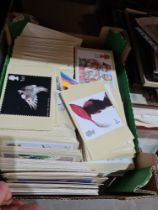 A quantity of First Day Covers, stamp related postcards and similar