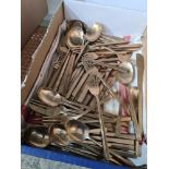 A quantity of Thai brass plated cutlery