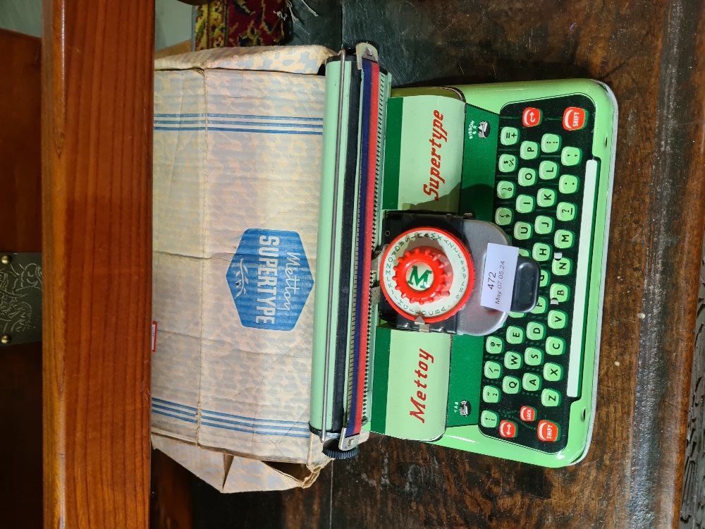 A Mettoy Supertype tin plate toy typewriter, with original box