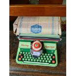 A Mettoy Supertype tin plate toy typewriter, with original box