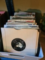 Vinyl; A box of vinyl 45s singles of various artists and genres