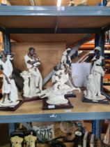 A selection of figures on plinths, manufactured by Guiseppe Armeni