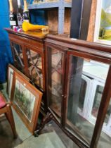 An Edwardian mahogany display cabinet having glazed doors and antique mahogany triple fold fire scre