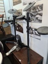 A Yamaha electronic drum kit, with pedal