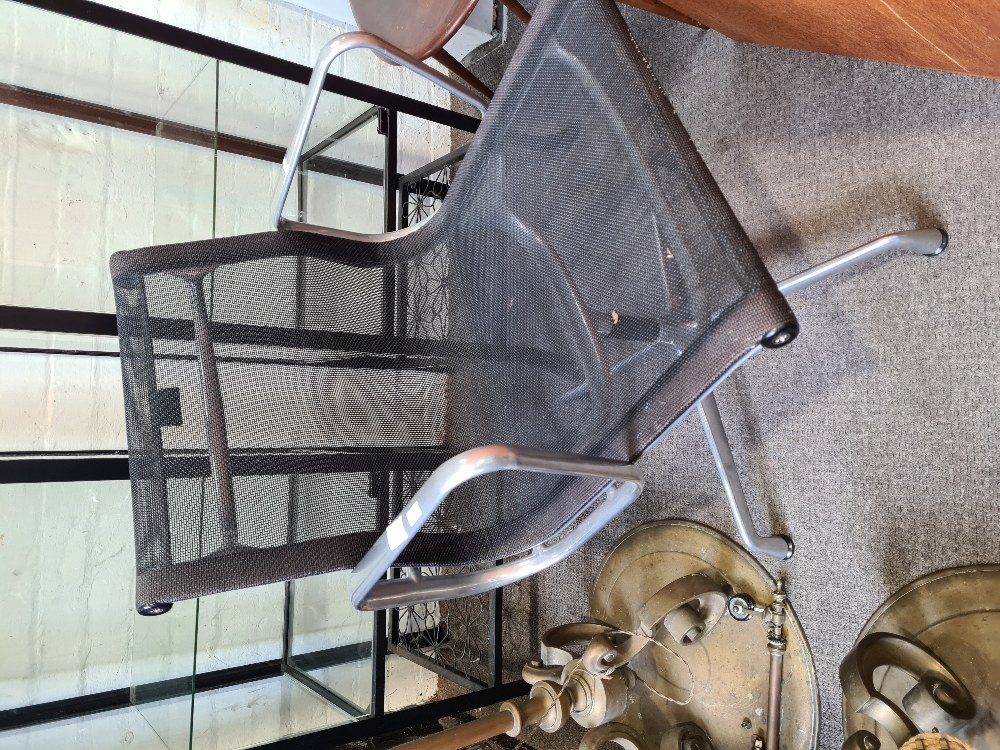 A late 20th Century Charles Eames Vitra office desk chair, aluminium supports with black mesh cover,