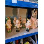 A vintage painted plaster group of Snow White & Seven Dwarfs