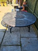 A Hartman metal work circular garden table with removable centre, 132cm