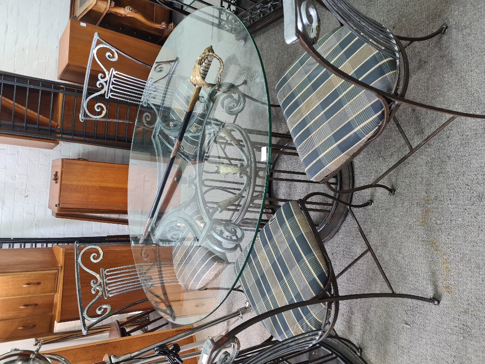 MULTI-YORK; A modern, Multi York, beautiful metalwork dining table having circular glass top and a s