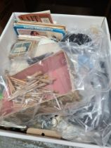 A box of needlework and sewing related items including patterns