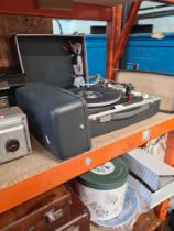 A Garrard AT-6 portable record player, speakers plus a selection of vinyl 45s singles