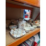 A quantity of 1930s Art Deco plates, a biscuit barrel, a butter dish and similar