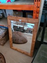 A pair of modern mirrors with wooden frame