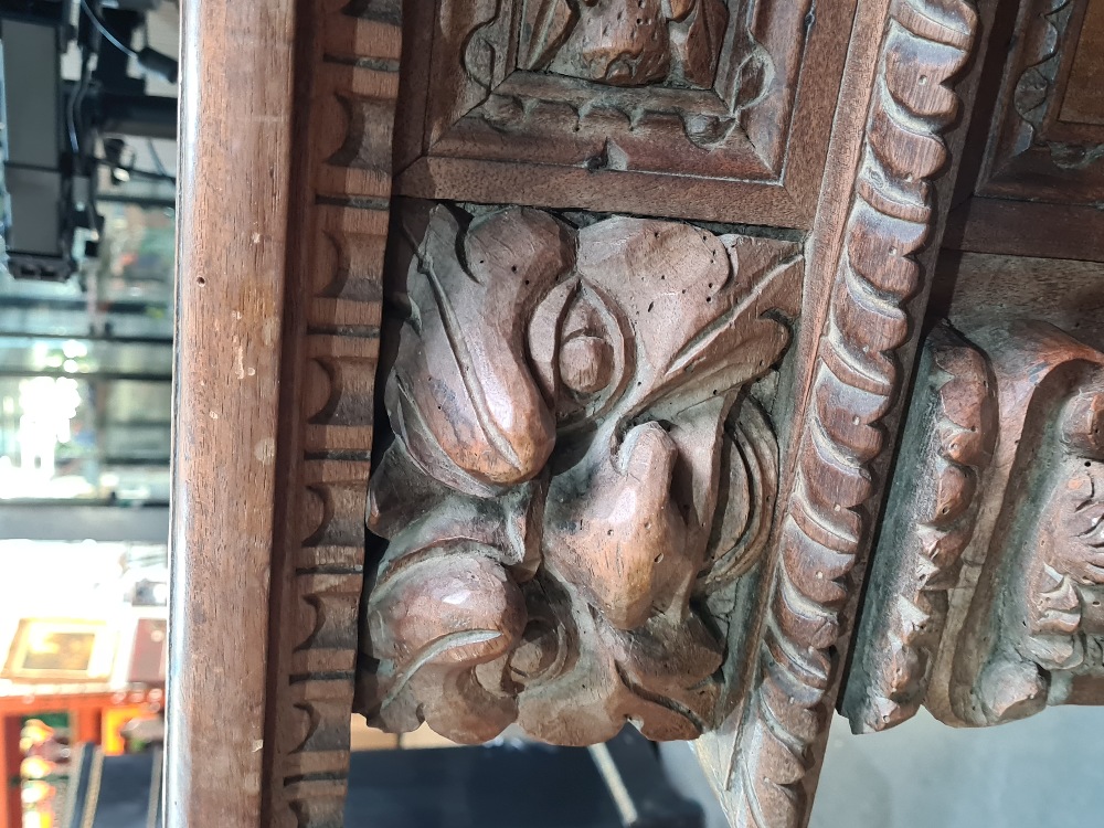 An antique carved walnut prayer kneeler/ Pri Dieu, probably Spanish, having central cupboard flanked - Image 7 of 11