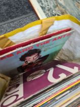 A quantity of vinyl LP records and 7" singles to include picture discs, The Beatles and a signed pho