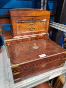 Three wool and inlaid boxes one having a bevelled glass viewing panel to the front