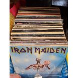 A box of vinyl LPs including Rock, Metal and Pop including bands such as Iron Maiden, Black Sabbath,