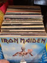 A box of vinyl LPs including Rock, Metal and Pop including bands such as Iron Maiden, Black Sabbath,