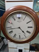 A round wall clock by Smith Enfield