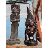 A large African carved wooden bust of Lady and a resin figure of the Mad Hatter