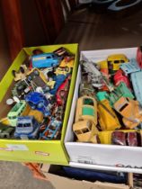Two small trays of vintage playworn Dinky toys and others