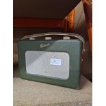 A vintage green leather Roberts Radio on revolving base