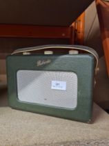 A vintage green leather Roberts Radio on revolving base