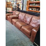A modern 3 seater leather sofa with matching armchair