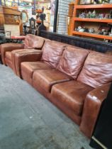 A modern 3 seater leather sofa with matching armchair