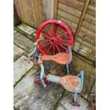Two vintage child's tricycles, Tri-Ang in style and a small wagon wheel
