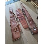 Three old leather gun bags