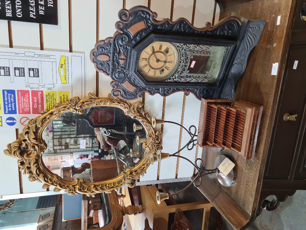 A gilt plaster mirror and an Ansonia mantle clock and sundry