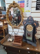 A gilt plaster mirror and an Ansonia mantle clock and sundry