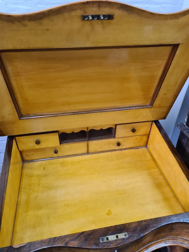 A Victorian walnut Davenport having four side drawers and carved scroll supports - Image 4 of 7