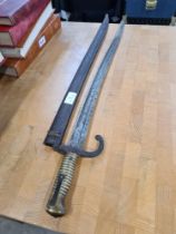 Late 19th Century bayonet with iron scabbard
