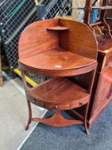 A Georgian mahogany corner washstand, a large oblong footstool and an occasional table