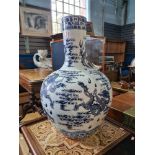 A large 20th Century Chinese blue and white vase decorated dragons, 60cm approx