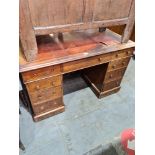 A Victorian mahogany twin pedestal desk having nine drawers (some handles missing and torn leather t