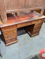 A Victorian mahogany twin pedestal desk having nine drawers (some handles missing and torn leather t