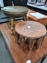 A brass stool having floral top and one other stool