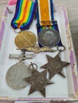 A World War I medal pair to 52589 Pte E.G. Jenkins, Devon Regiment, three World War II medals unname