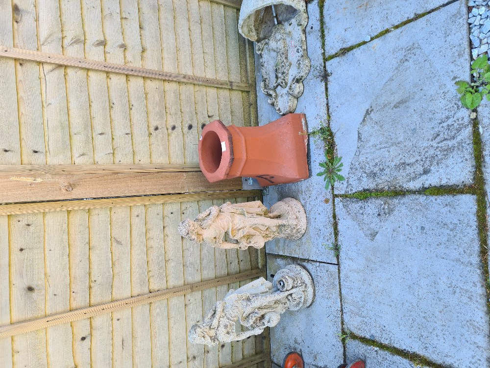 Two garden figures, a wall Font fountain and a chimney pot