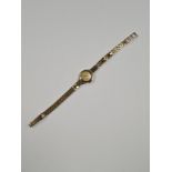 9ct yellow gold 'Nivada' ladies cocktail watch, golden dial, number and baton markers, on 9ct yellow